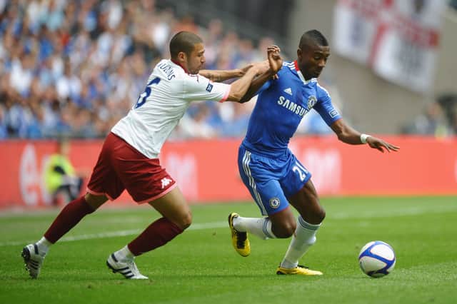Pompey's Hayden Mullins tries to get to grips with Chelsea's Salomon Kalou in the 2010 FA Cup final. Picture:  Laurence Griffiths/Getty Images