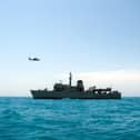 Portsmouth-based Royal Navy minehunter HMS Middleton joined forces with American, Kuwaiti and Iraqi forces to conduct a rescue exercise in the Gulf. Picture: A Kuwaiti police helicopter flies past HMS Middleton