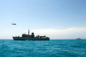 Portsmouth-based Royal Navy minehunter HMS Middleton joined forces with American, Kuwaiti and Iraqi forces to conduct a rescue exercise in the Gulf. Picture: A Kuwaiti police helicopter flies past HMS Middleton