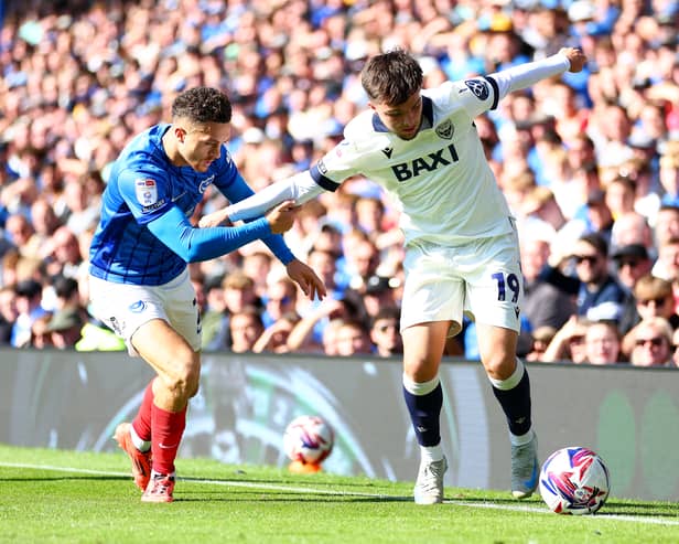 Tyler Goodrham battling Pompey's Jordan Williams.