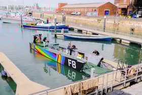 Falklands War Landing Craft F8 wrapped in Pride colours at Portsmouth Historic Dockyard.