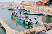 Falklands War Landing Craft F8 wrapped in Pride colours at Portsmouth Historic Dockyard.