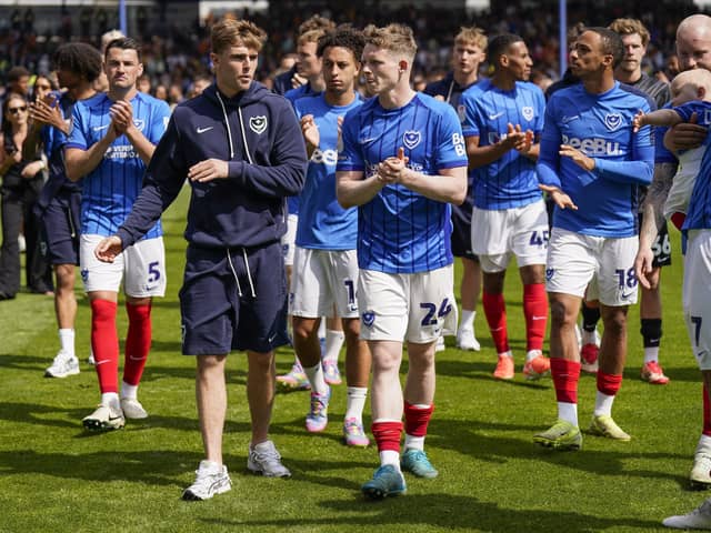 Pompey's Zak Swanson, centre left, with Terry Devlin has been handed a new Blues contract. Picture: Jason Brown/ProSportsImages