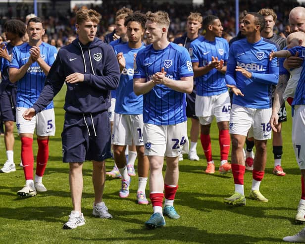 Pompey's Zak Swanson, centre left, with Terry Devlin has been handed a new Blues contract. Picture: Jason Brown/ProSportsImages
