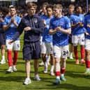 Pompey's Zak Swanson, centre left, with Terry Devlin has been handed a new Blues contract. Picture: Jason Brown/ProSportsImages