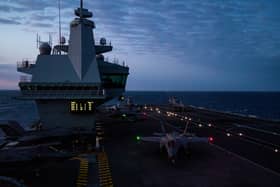 Pictured: The flight deck of HMS Prince of Wales during night flying operations for Exercise Med Strike during Operation Highmast as part of the UK Carrier Strike Group 2025.