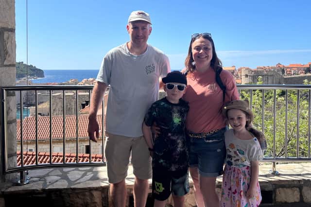 Tom Morton with partner Kim and their children Eddie and Rosanna waiting for the cable car