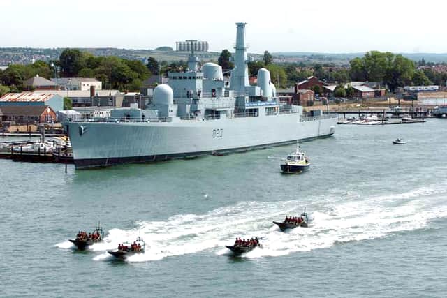 HMS Bristol, a Falklands War Royal Navy Destroyer, has been a long term fixture in Portsmouth over the years. Pictured: Royal Marine Commandos in Rigid Raiders pass HMS Bristol in Portsmouth harbour during a rehearsal for media for Trafalgar 200 in 2005.
