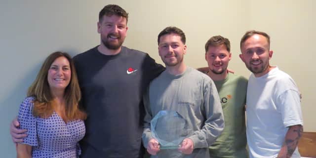 The Portsmouth Tennis Centre team celebrate being awarded the prestigious Tennis Opened Up Award at the LTA Tennis Awards.