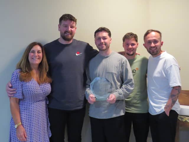 The Portsmouth Tennis Centre team celebrate being awarded the prestigious Tennis Opened Up Award at the LTA Tennis Awards.