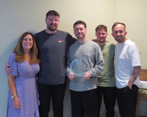 The Portsmouth Tennis Centre team celebrate being awarded the prestigious Tennis Opened Up Award at the LTA Tennis Awards.