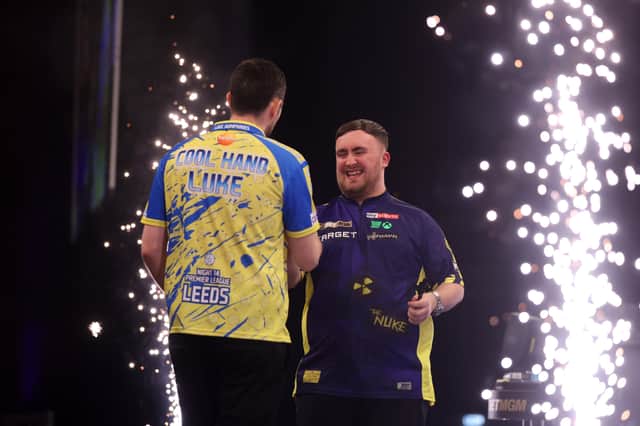 Luke Humphries (L) and Luke Littler (R) after a Premier League Darts match