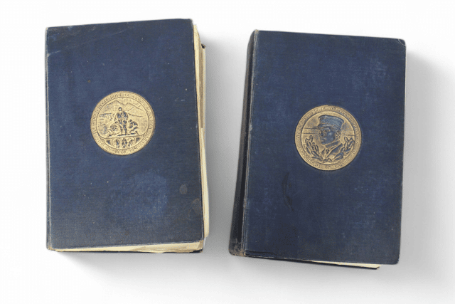 A signed copy of Captain Scott's The Voyage of The Discovery from 1905, addressed to Arthur Pilbeam.