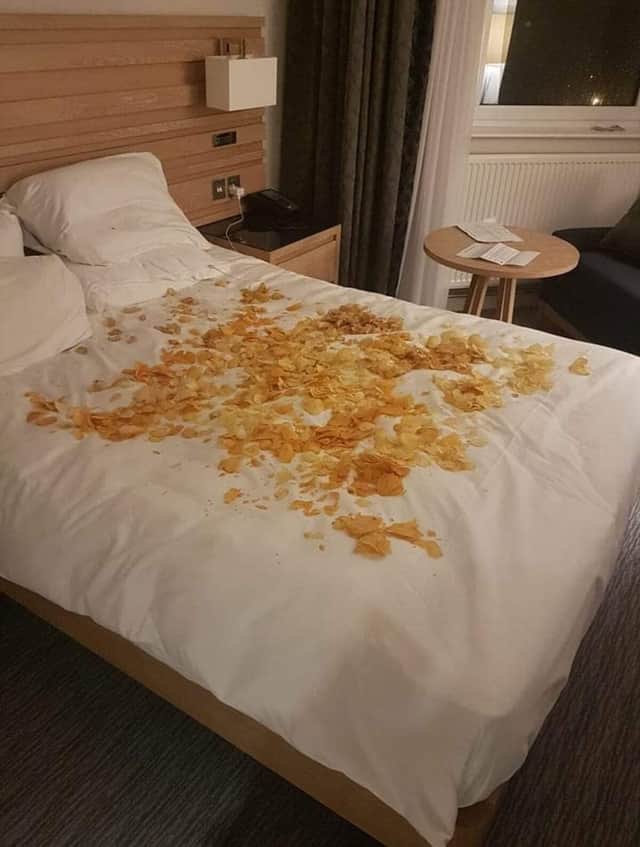 Johnnie secretly asked the hotel to place 30 assorted bags of crisps, but the staff misunderstood and sprinkled the crisps on the sheets like salty confetti