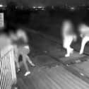 Men hold shut gates of level crossing in Barnsley, South Yorkshire.