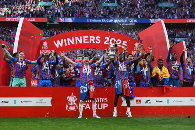 Former Pompey boy Joel Ward lifts the FA Cup for Crystal Palace. Pic: Getty