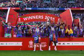 Former Pompey boy Joel Ward lifts the FA Cup for Crystal Palace. Pic: Getty