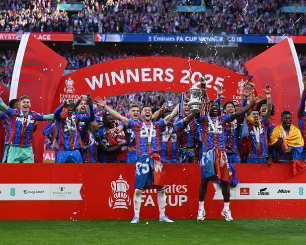 Former Pompey boy Joel Ward lifts the FA Cup for Crystal Palace. Pic: Getty