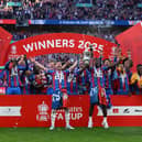 Former Pompey boy Joel Ward lifts the FA Cup for Crystal Palace. Pic: Getty