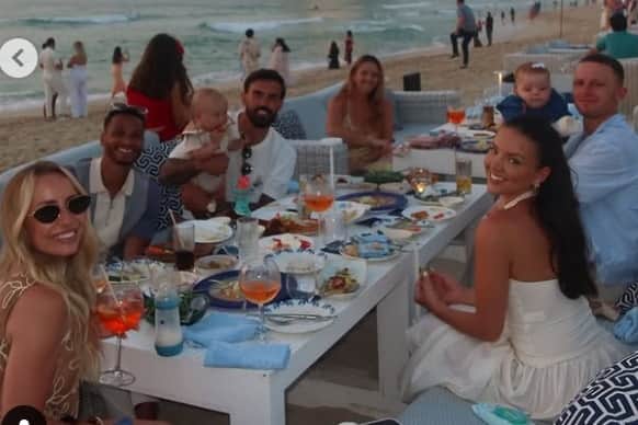 Josh Murphy, Marlon Pack and Colby Bishop enjoying dinner on the beach in Dubai.
