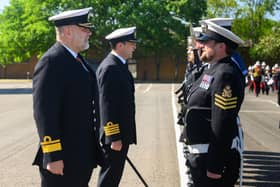 The Royal Navy Rear Admiral inspecting the guard at HMS Collingwood in Fareham during a visit.