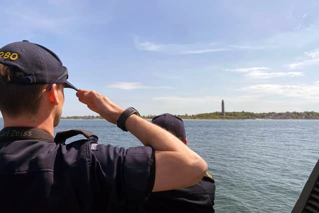 HMS Dasher salutes the German Naval Memorial at Laboe