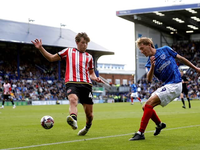 Pompey's Jacob Farrell, right, with Sheffield United's Sydie Peck. Pic: PA
