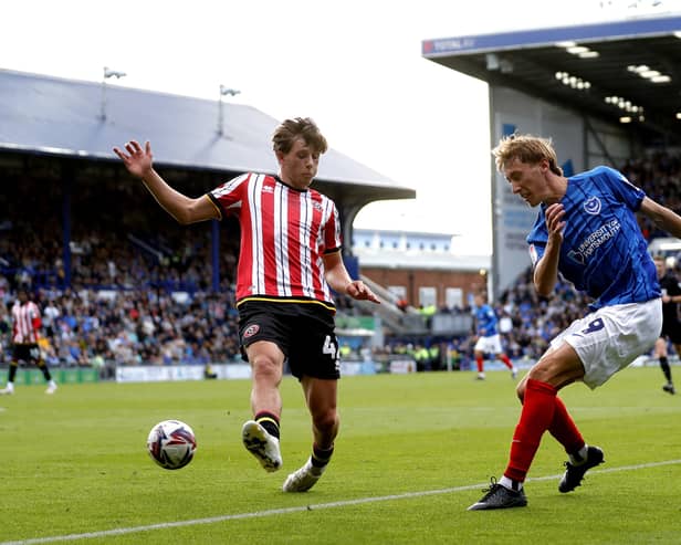 Pompey's Jacob Farrell, right, with Sheffield United's Sydie Peck. Pic: PA