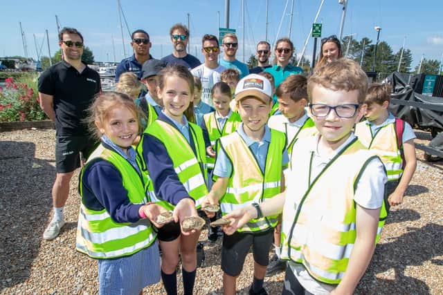 Pictured:  Emirates Great Britain SailGP Team and Emsworth Primary School explore the role of oysters in the seascape restoration. Picture: Habibur Rahman