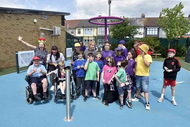 Pictured is: (back left) Nicola Payne, executive principal at Cliffdale Primary Academy with school captains, teachers and other children.