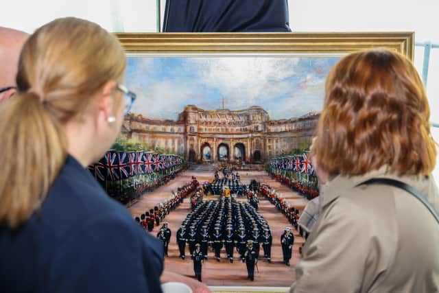Two paintings of the Royal Family were unveiled aboard HMS Queen Elizabeth in Portsmouth.
