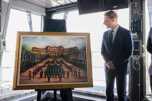 Two Royal Family paintings were unveiled to the public aboard HMS Queen Elizabeth in Portsmouth.