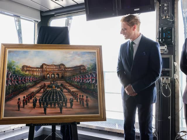 Two Royal Family paintings were unveiled to the public aboard HMS Queen Elizabeth in Portsmouth.