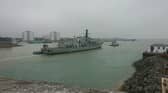 HMS Northumberland being towed into Portsmouth in May 2025.