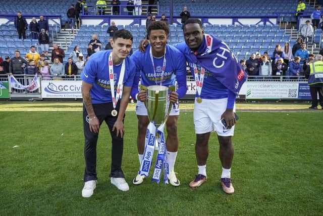 Christian Saydee with Alex Robertson and Kusini Yengi.