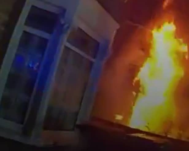 Dramatic moment massive house fire rages as police race to evacuate street.
