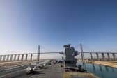 HMS Prince of Wales has transitioned through the Suez Canal and Red Sea. She has now reached the Indian Ocean. Pictured: The flight deck of HMS Prince of Wales as the ship goes under the Al Salam Bridge whilst transiting the Suez Canal en route to the Red Sea as part of Operation Highmast, on May 24, 2025.