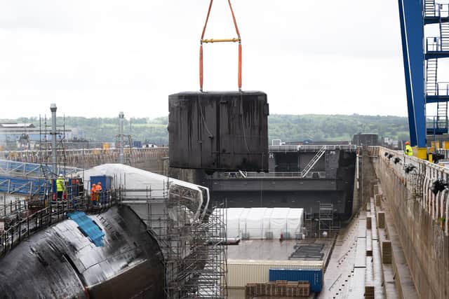 The fin being removed from HMS Swiftsure, a Royal Navy submarine which will be fully dismantled by 2026.