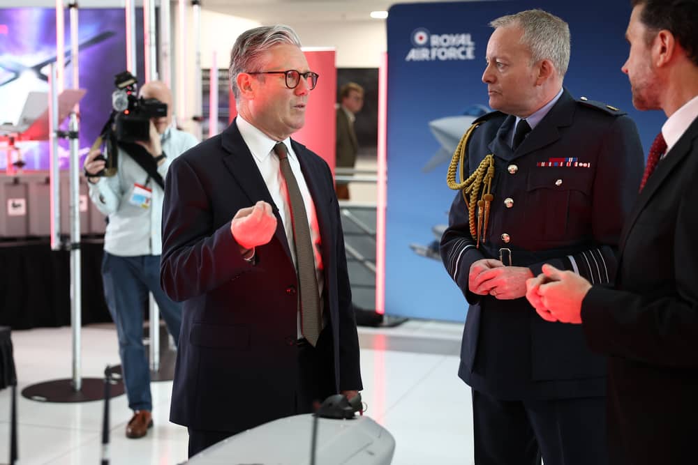 Air Chief Marshal Sir Richard Knighton is set to be named as the new Chief of Defence Staff, according to national reports. Pictured: Prime Minister Sir Keir Starmer (L) alongside Air Chief Marshal Richard Knighton (2R) during a visit to a defence contractor on May 2, 2025 in Bedfordshire, England.