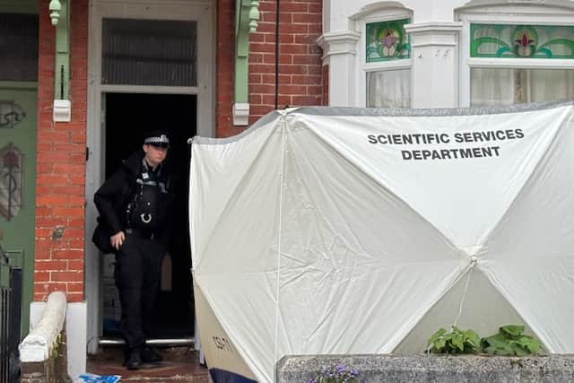 A white forensic tent was seen outside a house in Wadham Road after a woman’s body was found