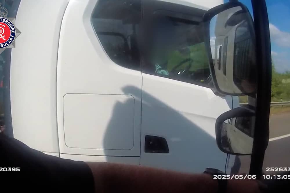 Lorry driver caught rolling cigarette with no hands on wheel