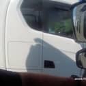 Lorry driver caught rolling cigarette with no hands on wheel