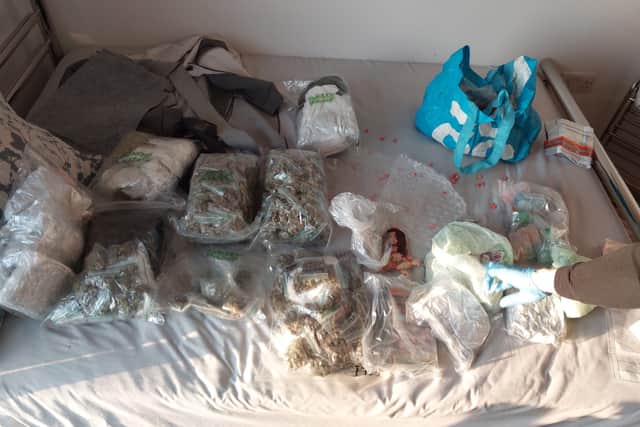 Police have seized a large quantity of drugs, weapons, and £15k from an address in Gunwharf Quays.