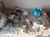Police have seized a large quantity of drugs, weapons, and £15k from an address in Gunwharf Quays.