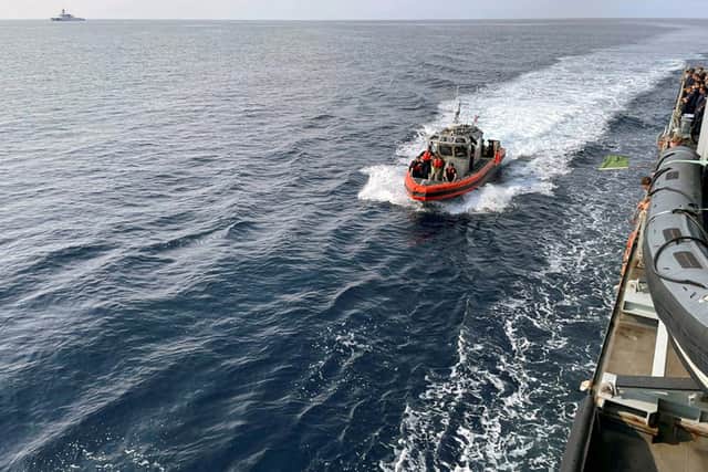 One of the USCGC Stratton's sea boats approaches HMS Spey to starboard. Royal Navy sailors were invited aboard an America ship ahead of HMS Prince of Wales' arrival.