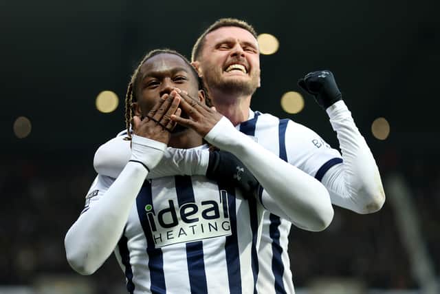 John Swift celebrates with West Brom team-mate Brandon Thomas-Asante during a game against Blackburn Rovers.