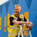 My Dog Sighs, a famous artist in Portsmouth, has teamed up with Victorious Festival to create a huge piece of artwork on a shipping container. 