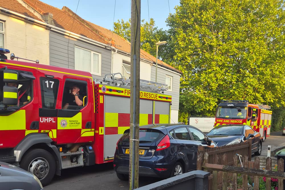 Two boys have been arrested on suspicion of arson after a large fire erupted from a tree and destroyed several garages in Hambrook Road, Gosport.