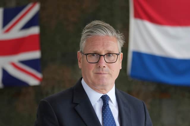 Prime Minister Keir Starmer listens to a question from a reporter as he visiting the Netherlands marines training base, as part of the UK-Netherland Joint Amphibious Force on June 24, 2025 in Rotterdam, Netherlands. It's expected that the UK will commit to spending five per cent of GDP on defence by 2035.