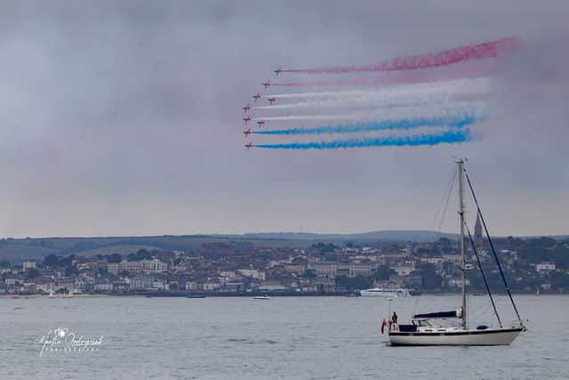 The Red Arrows display watched from Stokes Bay. Picture Marcin Jedrysiak